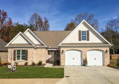 tan brick house with metal roof|light tan house colors.